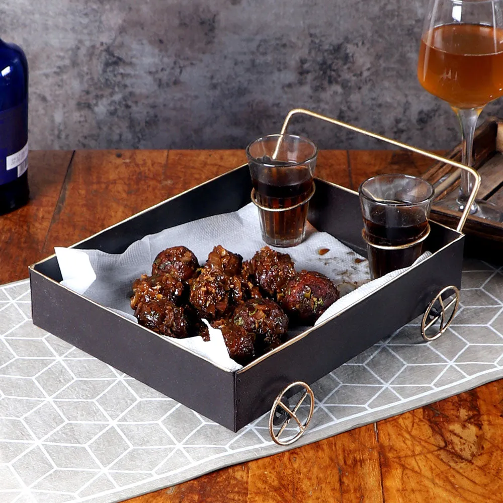 Classy Black Snacks Platter With Golden Wheels & Tea Glass