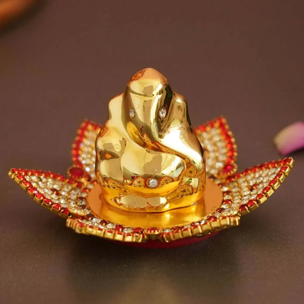 Golden & Red Detailed Decorative Mini Lord Ganesha Showpiece On Flower