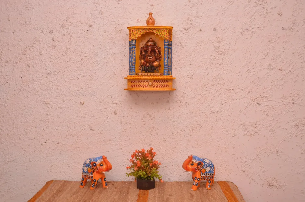 Intricately Carved And Handpainted Wooden Pooja Mandir in Yellow Colour