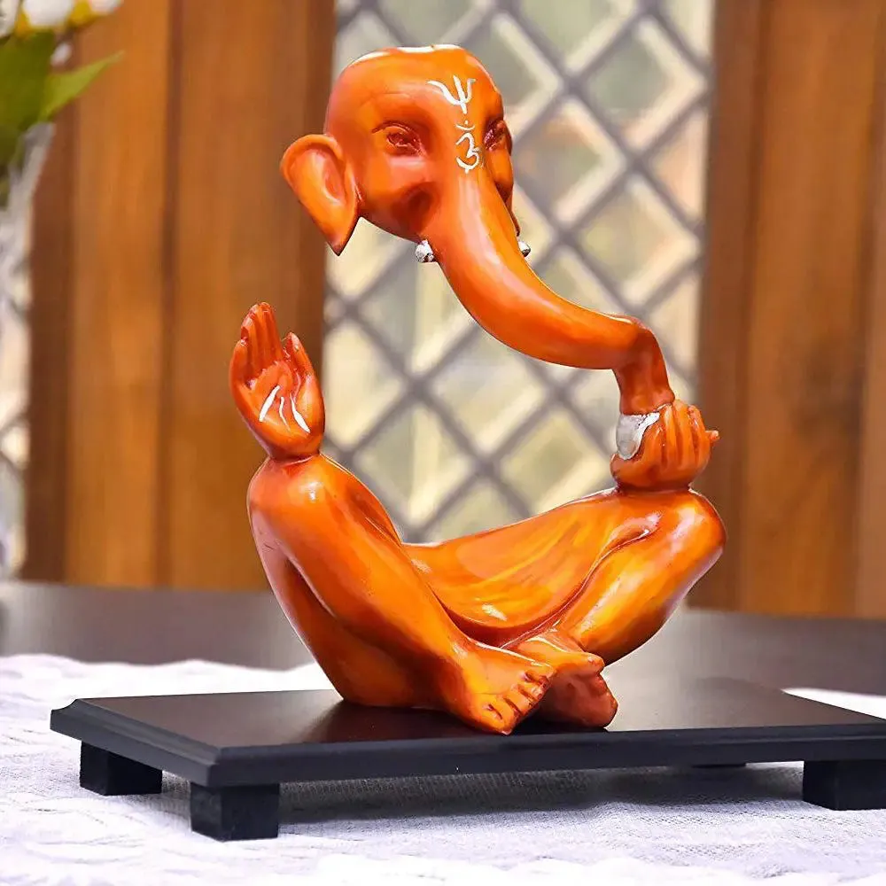 Modern Art Orange Colored Ganesh Idol