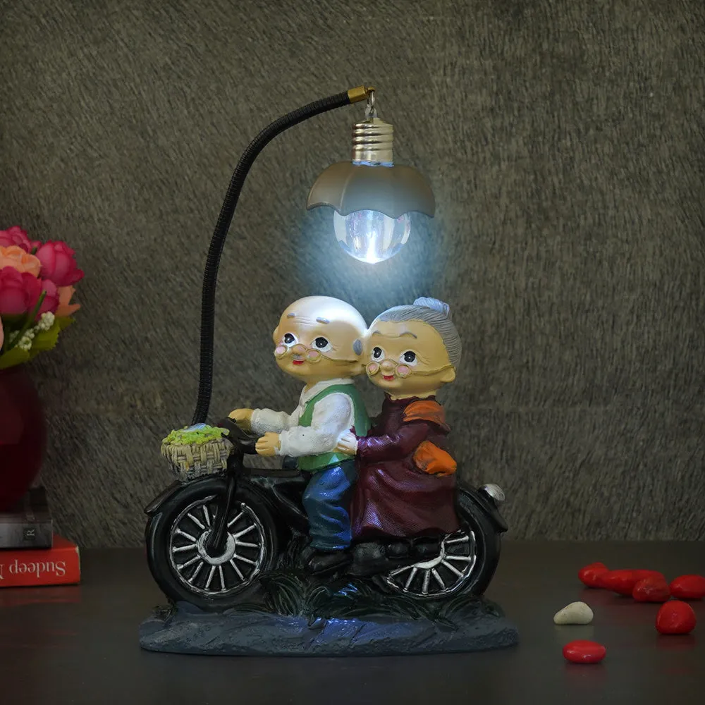 Premium Old Age Couple LED Bike Showpiece for Valentine's Day