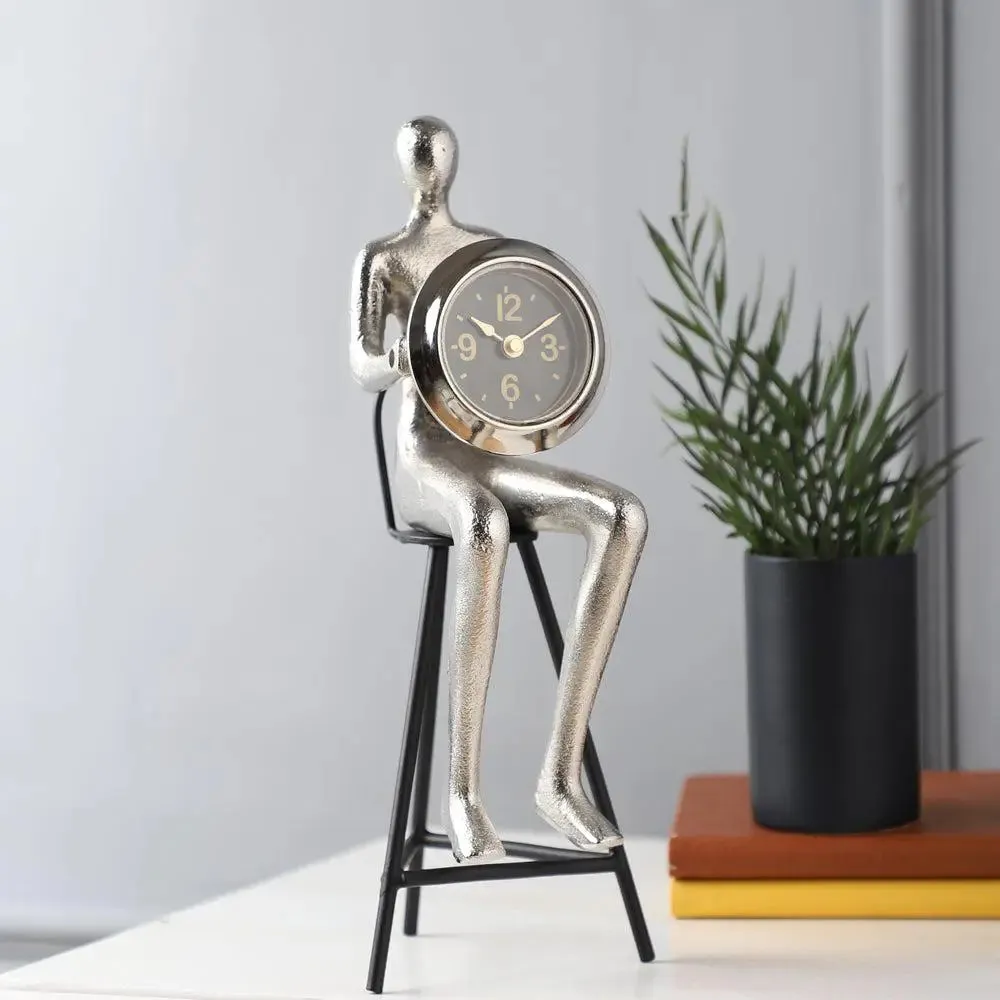 Shiny Silver Sitting Man Holding Clock Table Accent